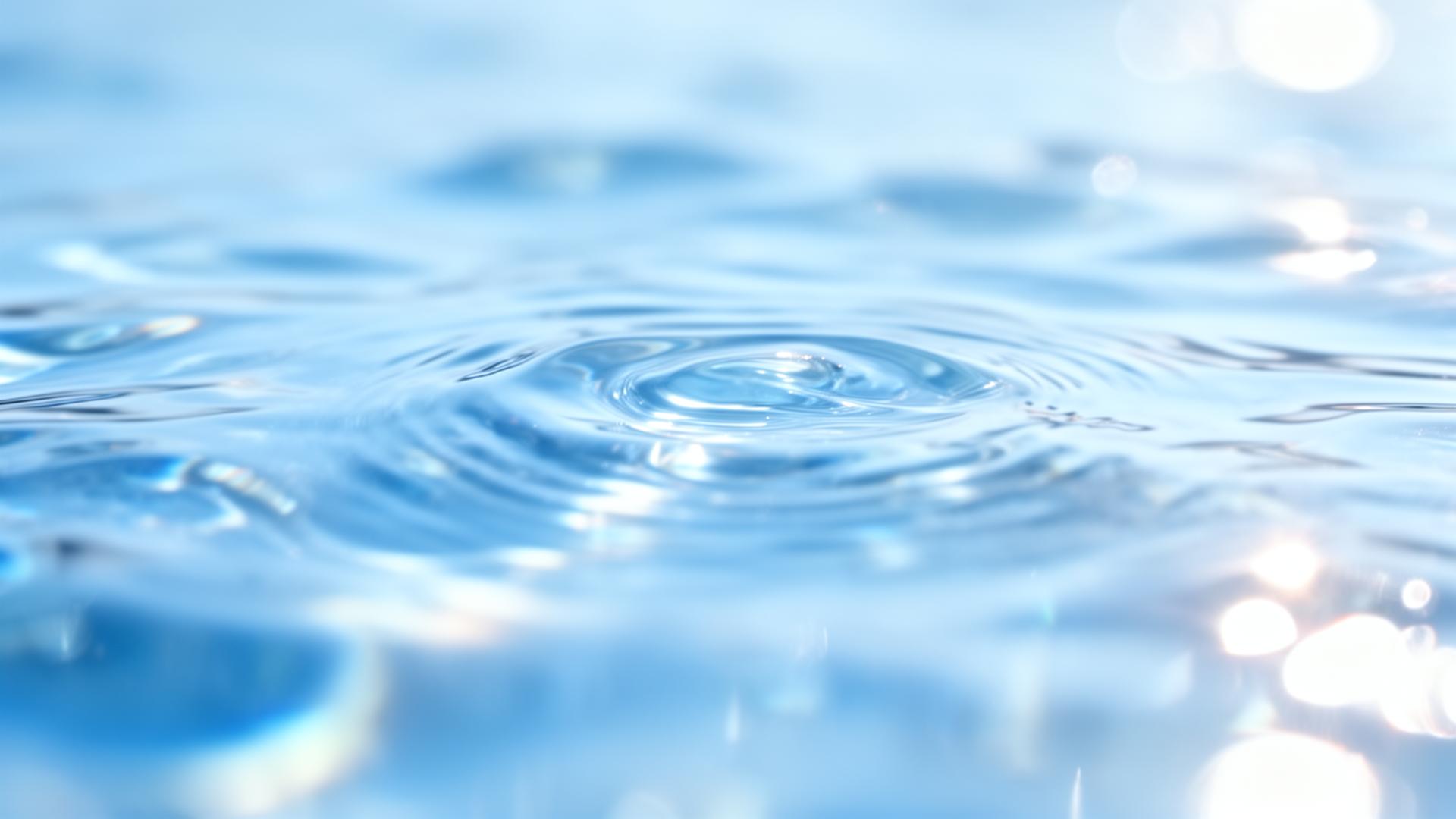 Clean water surface with refracted azure light